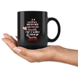 A MOTHER HOLDS HER CHILDRENS HANDS COFFEE MUG